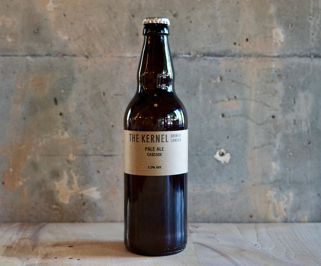 Bottle of The Kernel Pale Ale - Cascade on a wooden surface with a rustic background