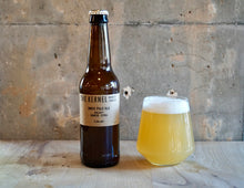 Load image into Gallery viewer, Bottle and glass of beer labeled &#39;The Kerne India Pale Ale - Galaxy, SImcoe, Citral&#39; on a wooden surface with a concrete wall background.
