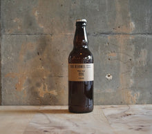 Load image into Gallery viewer, A single 500ml The Kernel Brewery Pale Ale - Mosaic, Eclipse bottle stood on a wooden tabl in front of a concrete wall. 
