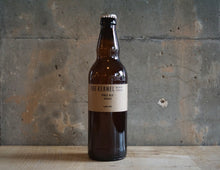 Load image into Gallery viewer, A single bottle of The Kernel Brewery Pale Ale - Azacca (500ml). It is stood infront of a concrete wall. 

