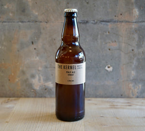 Beer bottle with 'The Kernel' label on a textured surface
